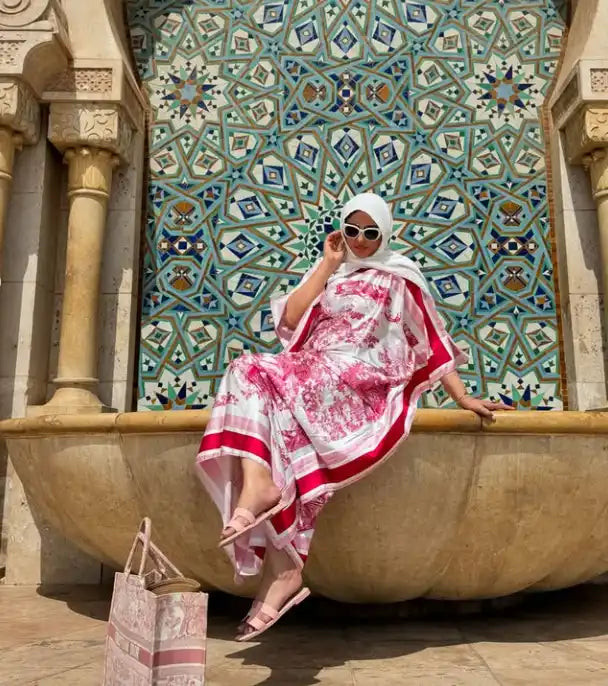 Woman in pink and white kaftan.
